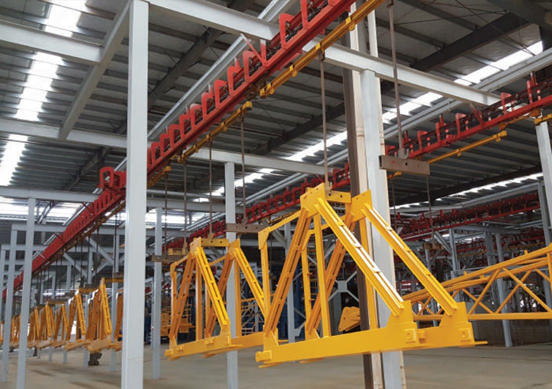 Tower crane components in a manufacturing assembly line