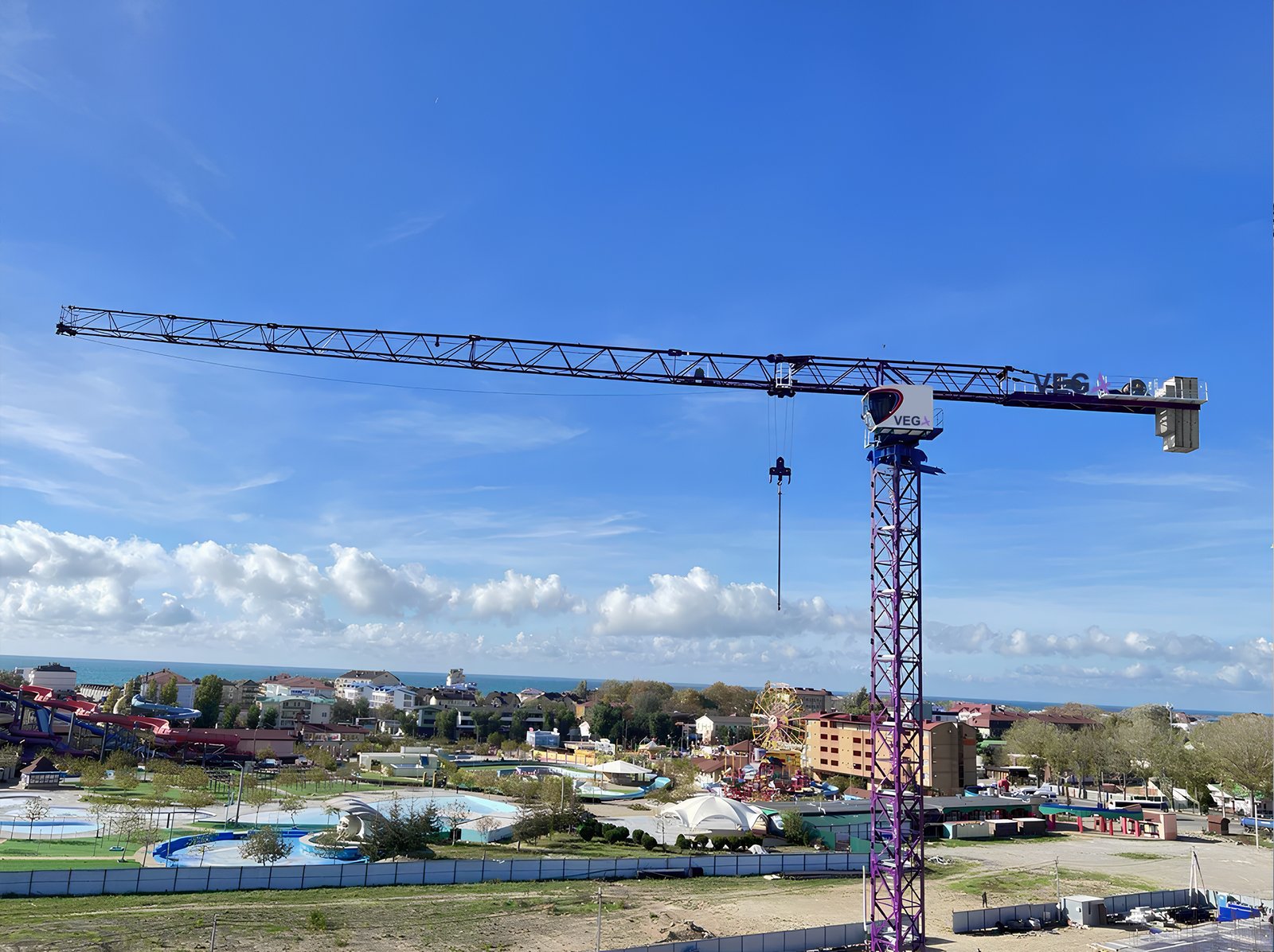 VEGA tower crane overlooking a construction site by the seaside